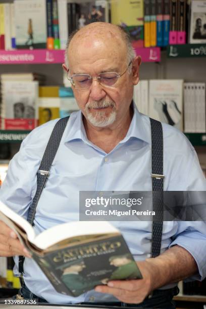 Spanish writer Juan Eslava Galán poses during the signing of his latest book, "La tentación del Caudillo", at the Madrid Book Fair on September 12,...