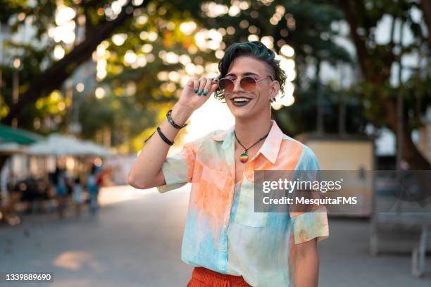 gay man smiling outdoors - transgender bildbanksfoton och bilder