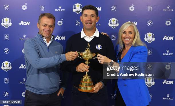 Team Europe Ryder Cup Captain Padraig Harrington pictured with his wife Caroline Harrington and manager Adrian Mitchell and the Ryder Cup during Day...