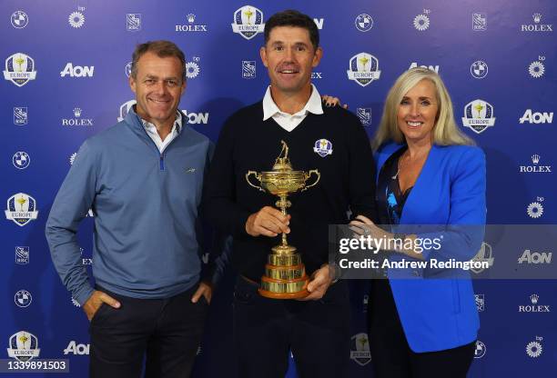 Team Europe Ryder Cup Captain Padraig Harrington pictured with his wife Caroline Harrington and manager Adrian Mitchell and the Ryder Cup during Day...