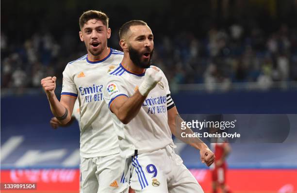 Karim Benzema of Real Madrid celebrates with Federico Valverde of Real Madrid after scoring their team's first goal during the La Liga Santander...