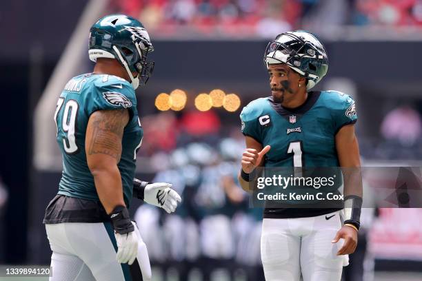 Jalen Hurts and Brandon Brooks of the Philadelphia Eagles react after a two-point conversion during the fourth quarter against the Atlanta Falcons at...