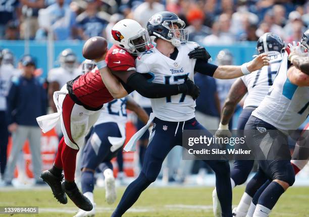 Ryan Tannehill of the Tennessee Titans fumbles after being hit by Chandler Jones of the Arizona Cardinals during the third quarter at Nissan Stadium...