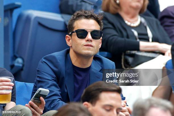 Actor Rami Malek watches the Men's Singles final match between Daniil Medvedev of Russia and Novak Djokovic of Serbia on Day Fourteen of the 2021 US...