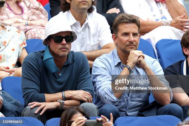 Actors Brad Pitt and Bradley Cooper watch the Men's Singles final match between Daniil Medvedev of Russia and Novak Djokovic of Serbia on Day...