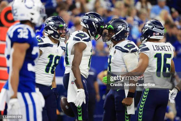 Metcalf and Russell Wilson of the Seattle Seahawks celebrate a 15-yard touchdown during the fourth quarter against the Indianapolis Colts at Lucas...