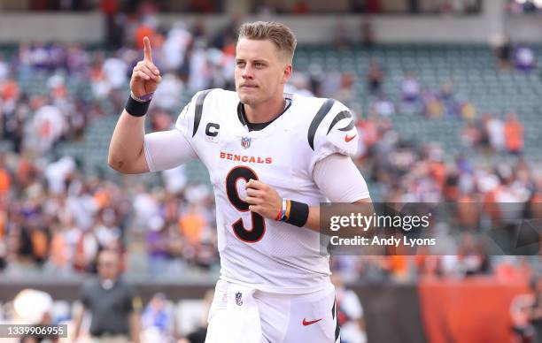 Joe Burrow of the Cincinnati Bengals jogs off the field after beating the Minnesota Vikings 27-24 in overtime of the Cincinnati Bengals against the...