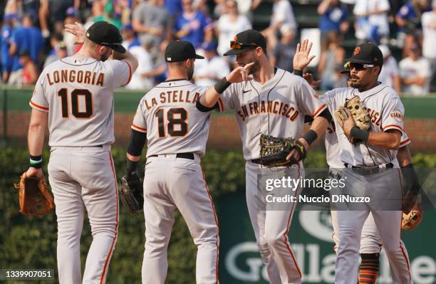 The San Francisco Giants celebrate their team win over the Chicago Cubs at Wrigley Field on September 12, 2021 in Chicago, Illinois. The Giants...