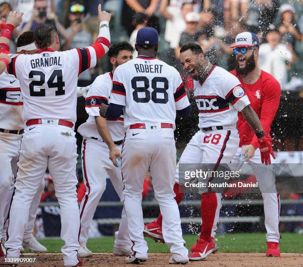 Leury Garcia of the Chicago White Sox is dosed by teammates as he comes to the plate after hitting a walk-off, solo home run in the 9th inning...