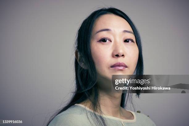 portrait of asian woman - woman concerned stock pictures, royalty-free photos & images