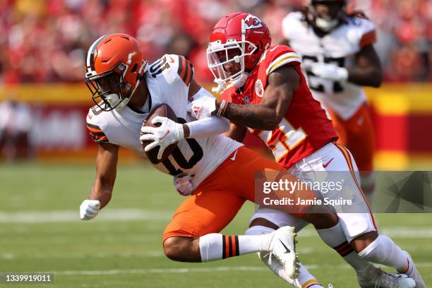 Anthony Schwartz of the Cleveland Browns is tackled by Mike Hughes of the Kansas City Chiefs at Arrowhead Stadium on September 12, 2021 in Kansas...