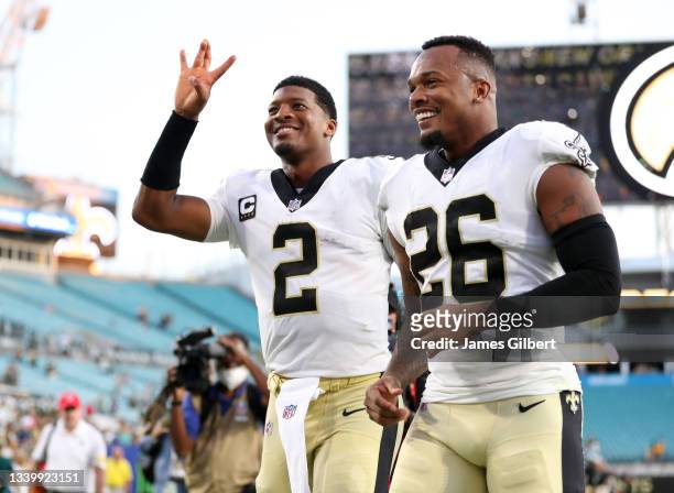 Jameis Winston and P.J. Williams of the New Orleans Saints celebrate after defeating the Green Bay Packers at TIAA Bank Field on September 12, 2021...
