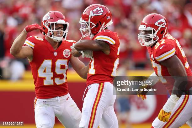 Mike Hughes of the Kansas City Chiefs celebrates with Daniel Sorensen and Malik Herring against the Cleveland Browns during the second half at...
