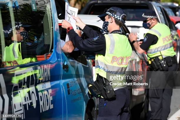 Police are seen directing motorists at the Coolangatta border check point on Griffith St on September 13, 2021 in Gold Coast, Australia. Queensland...
