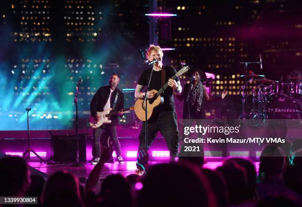 In this image released on September 12, Ed Sheeran performs onstage at Pier 3 in Brooklyn for the 2021 MTV Video Music Awards broadcast on September...