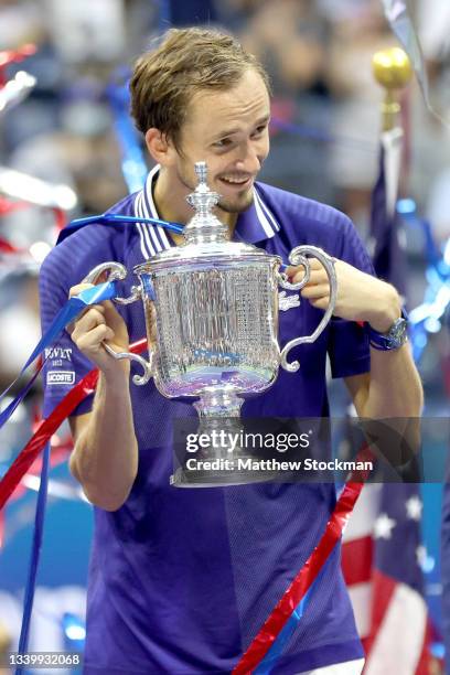 Daniil Medvedev of Russia celebrates with the championship trophy after defeating Novak Djokovic of Serbia to win the Men's Singles final match on...