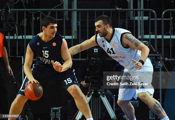 Esteban Batista, #15 of Anadolu Efes competes with Nikola Pekovic, #41 of Partizan mt:s during the 2011-2012 Turkish Airlines Euroleague Regular...