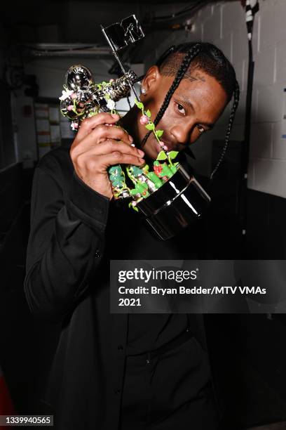 Travis Scott poses backstage with the Best Hip Hop award for "Franchise" during the 2021 MTV Video Music Awards at Barclays Center on September 12,...