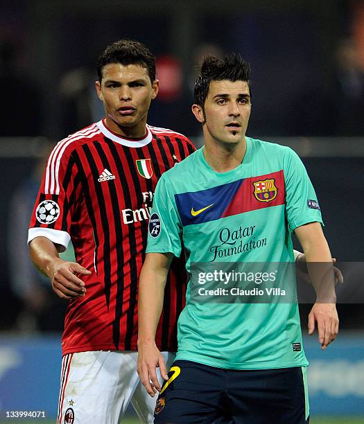 Thiago Silva of AC Milan and David Villa of FC Barcelona in action during the UEFA Champions League group H match between AC Milan and FC Barcelona...