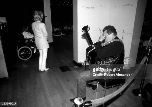 Veteran Grand Ole Opry member and country music performer Stonewall Jackson sits backstage at the Grand Ole Opry circa 1995 in Nashville, Tennessee,...