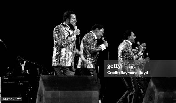 Singers Levi Stubbs, Renaldo 'Obie' Benson, Abdul 'Duke' Fakir and Lawrence Payton, Jr. Of The Four Tops performs at the Auditorium Theatre in...