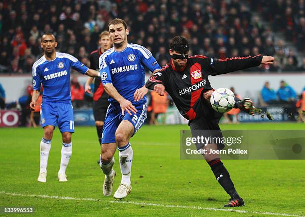 Michael Ballack of Leverkusen and Branislav Ivanovic of Chelsea battle for the ball during the UEFA Champions League group E match between Bayer 04...