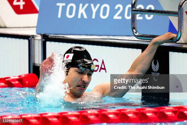 Takayuki Suzuki of Team Japan celebrates winning the gold medal after competing in the Swimming Men's 100m Freestyle - S4 Final on day 2 of the Tokyo...