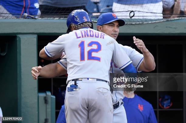 Francisco Lindor of the New York Mets celebrates with manager Luis Rojas after hitting the game winning two-run home run in the ninth inning against...