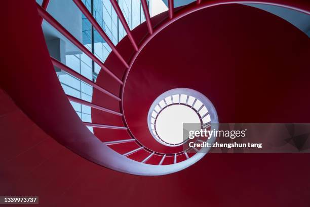 close-up view of red spiral staircase. - phillips de pury company host private view of contemporary art stockfoto's en -beelden