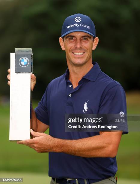 Billy Horschel of the United States of America poses with the trophy after winning The BMW PGA Championship at Wentworth Golf Club on September 12,...