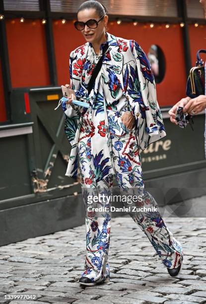 Guest is seen wearing a Tory Burch suit outside the Tory Burch show during New York Fashion Week S/S 22 on September 12, 2021 in New York City.