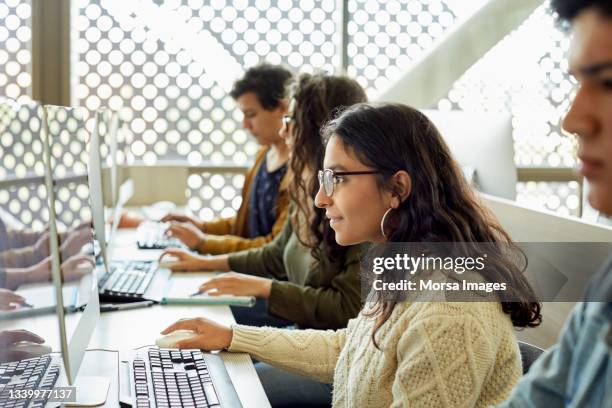 young student studying in computer lab - asian-students-classroom-computer stock pictures, royalty-free photos & images