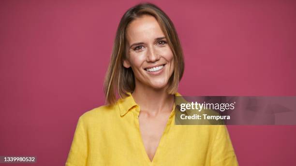 headshot portrait of a woman in casual clothes. - yellow shirt stock pictures, royalty-free photos & images