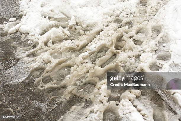foot steps in snow slush - snösörja bildbanksfoton och bilder
