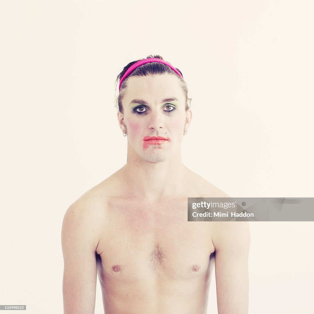 Man in 20's With Make Up Running Down his Face