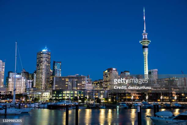night view of viaduct harbour in auckland, new zealand - auckland viaduct stock pictures, royalty-free photos & images