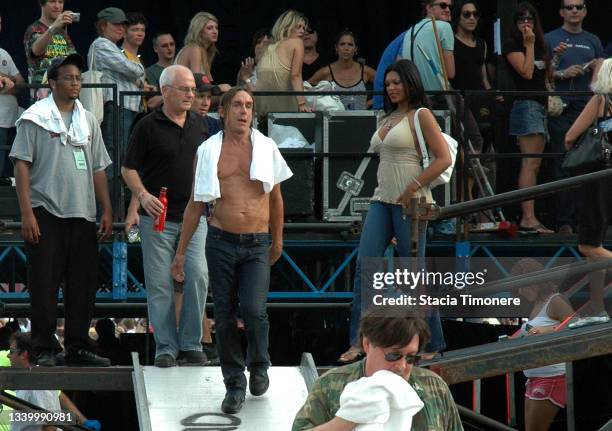 Iggy Pop exits the stage preceded by Ron Asheton and followed by his wife Nina Alu at Lollapalooza in Chicago, Illinois, USA on August 5, 2007.