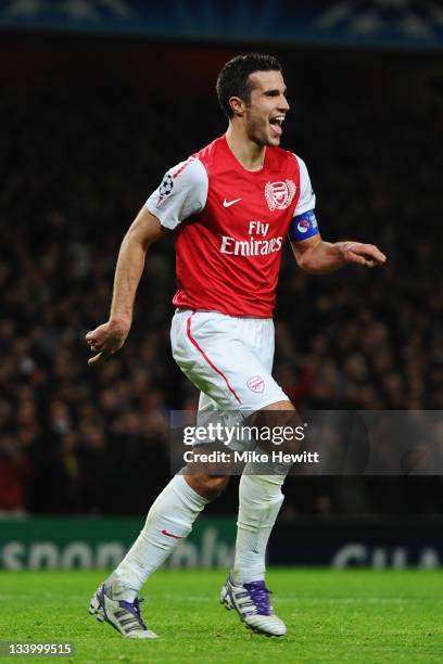 Robin van Persie of Arsenal celebrates scoring their second goal during the UEFA Champions League Group F match between Arsenal FC and Borussia...