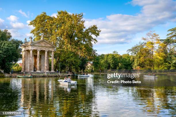a delicate scene in pastel colors on the lake of villa borghese in the heart of the main park of rome - villa borghese stock pictures, royalty-free photos & images