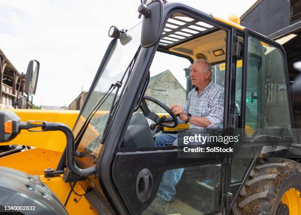 senior farmer ready for work - tractor steering wheel stock pictures, royalty-free photos & images