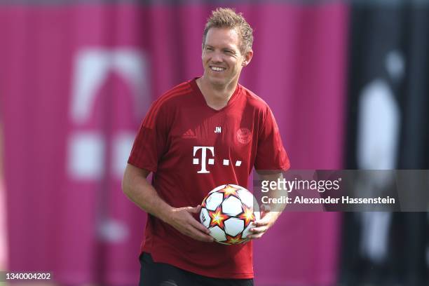 Julian Nagelsmann, head coach of FC Bayern München smiles during a FC Bayern training session at Saebener Strasse training ground on September 13,...