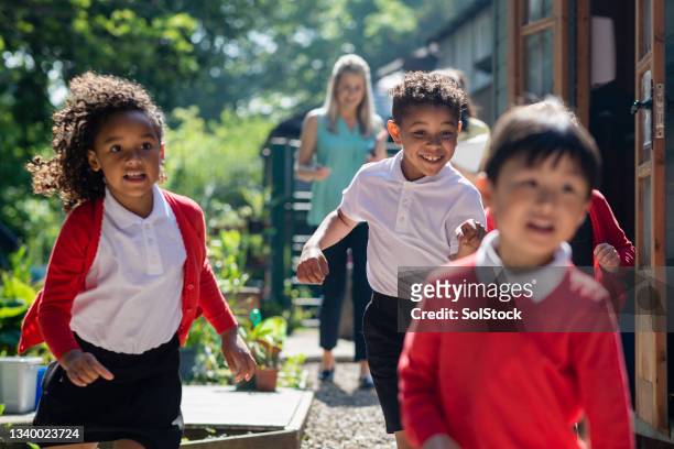slow down kids - children playing outside stock pictures, royalty-free photos & images
