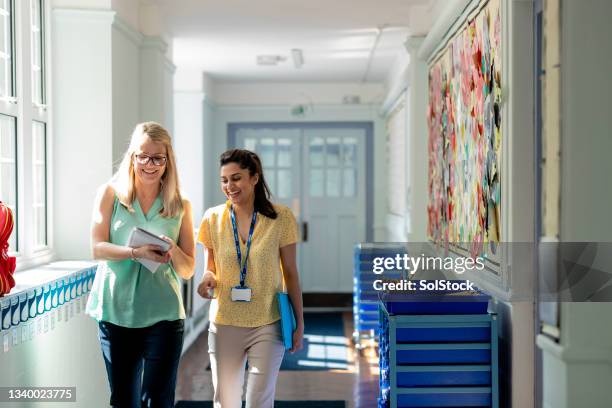 sharing teaching ideas - college corridor stock pictures, royalty-free photos & images