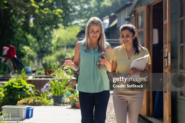 morning teacher meeting - working side by side stock pictures, royalty-free photos & images