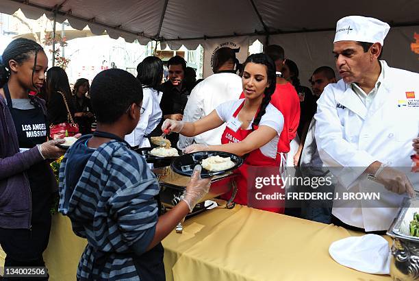 Kim Kardashian and Los Angeles Mayor Antonia Villaraigosa feed the homeless and those less fortunate at the Los Angeles Mission on November 23, 2011...