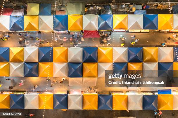 high view of night market colorful tent retail shop and lighting. - entertainment tent stockfoto's en -beelden