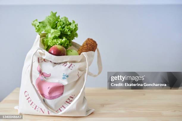 eco-friendly cotton bag with vegetables and fruits with an individual pattern - tote bag stock pictures, royalty-free photos & images