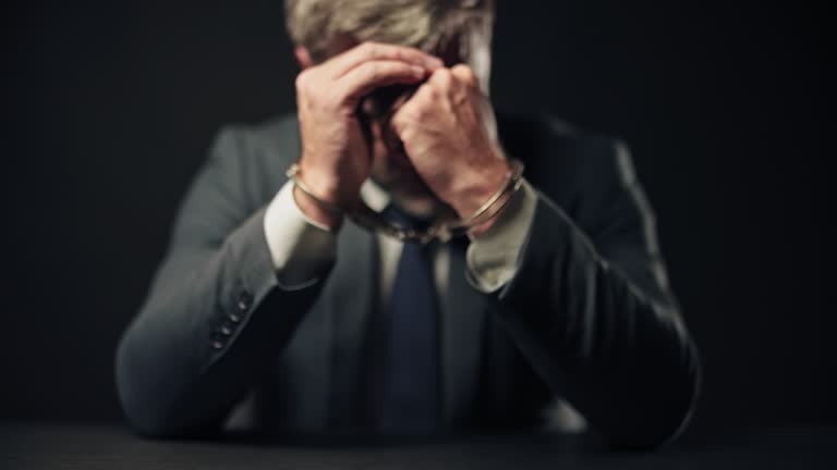 https://media.gettyimages.com/id/1340054612/video/businessman-in-handcuffs-feeling-hopelessness-unfair-trial-flawed-system.jpg?b=1&s=640x640&k=20&c=-VeZC8t-Yk5F77Twlq1cLVS3K7Ag1a8Q5tdDdForxHM=