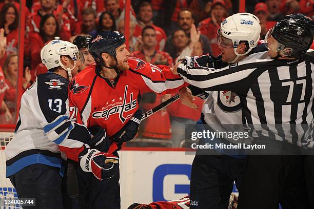 Brooks Laich of the Washington Capitals fights Nik Antropov of the Winnipeg Jets during a NHL hockey game on November 23, 2011 at the Verizon Center...