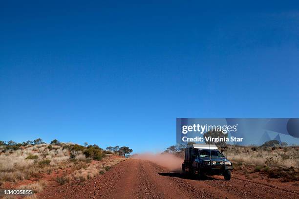 dusty dirt road travelling australia - driving car australia road copy space sunlight travel destinations colour image day getting stock pictures, royalty-free photos & images